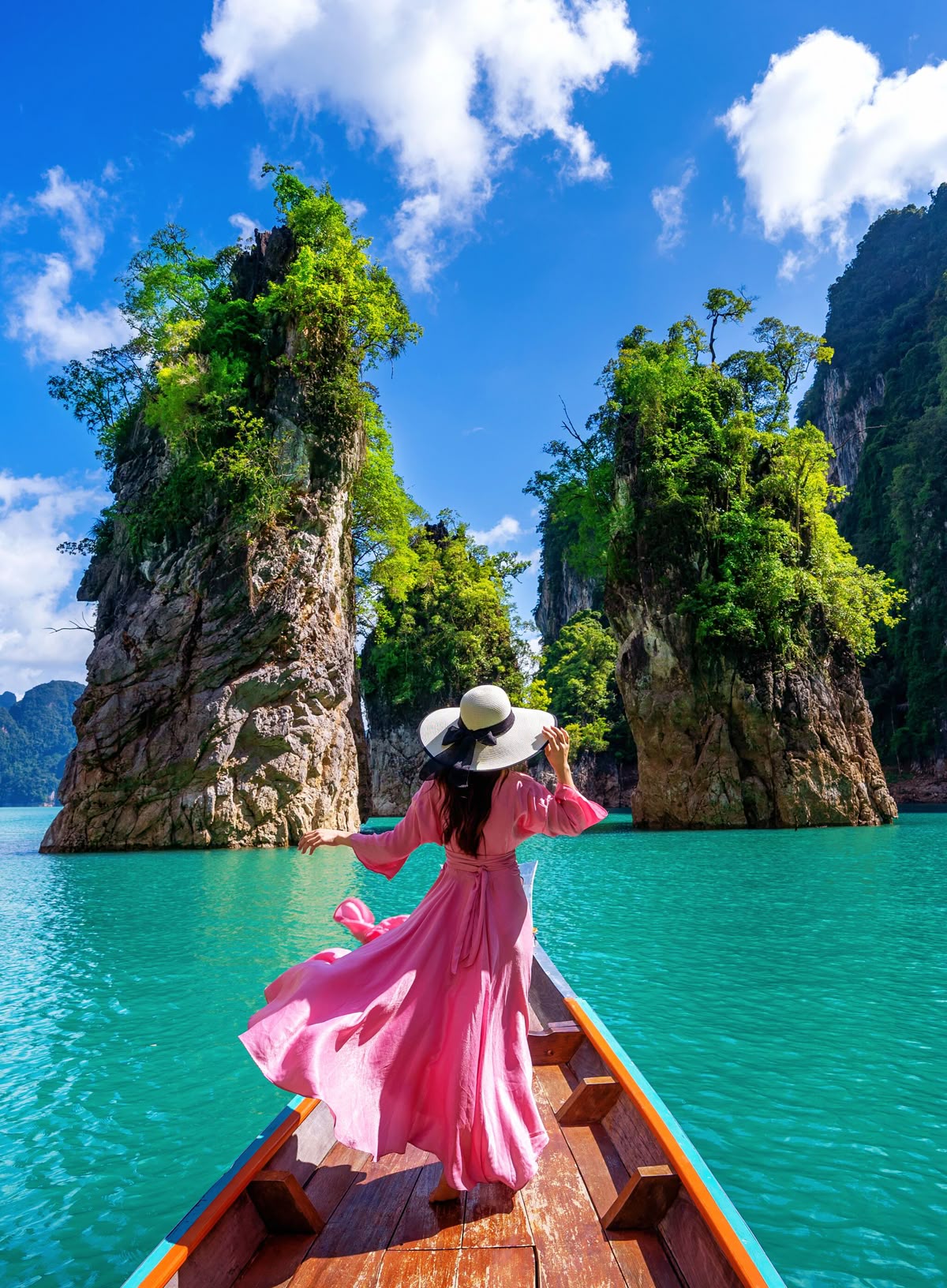 Traveler in pink dress on boat